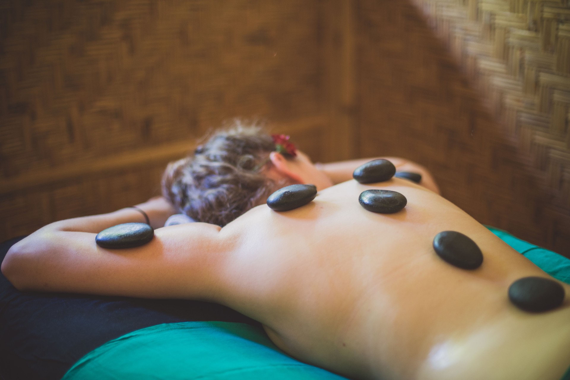Woman relaxing on lastone therapy